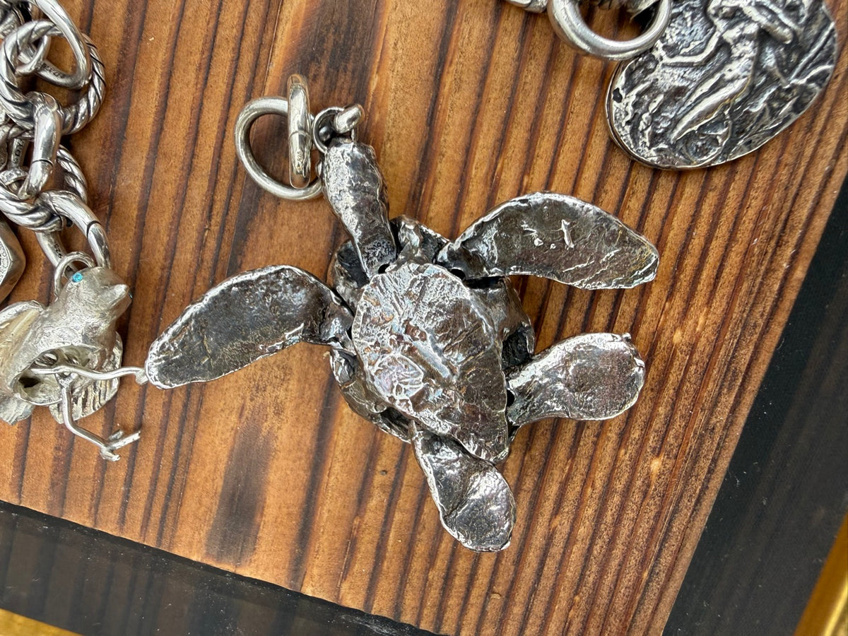 Articulated large lost-wax cast turtle charm, underside view