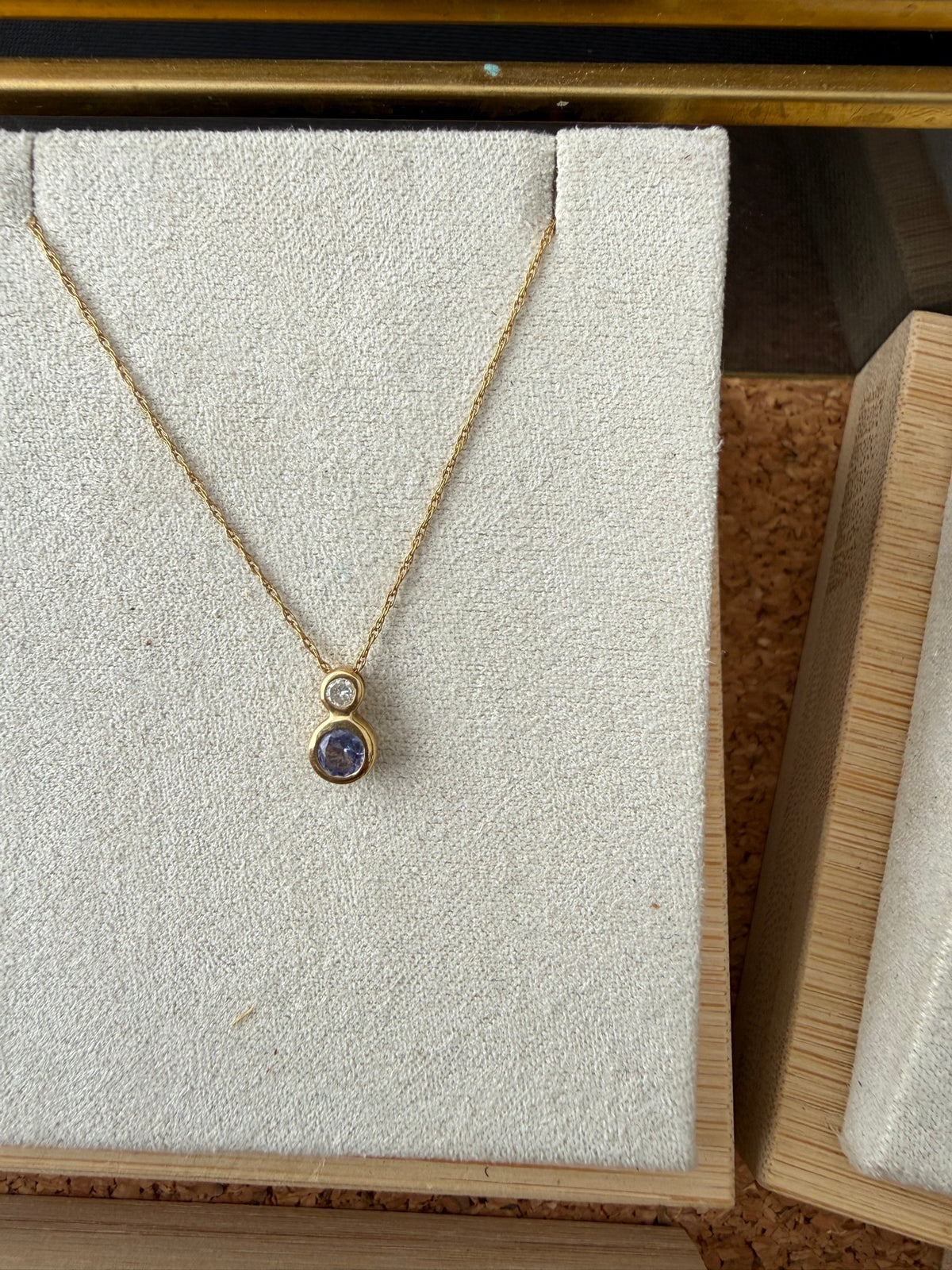 Tanzanite and diamond pendant in 14k gold on a 16-inch chain