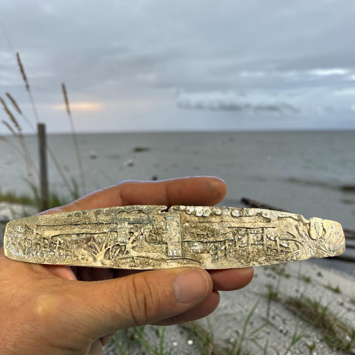 Cape Henlopen Watchtowers sterling silver cuff, full scene held at the beach