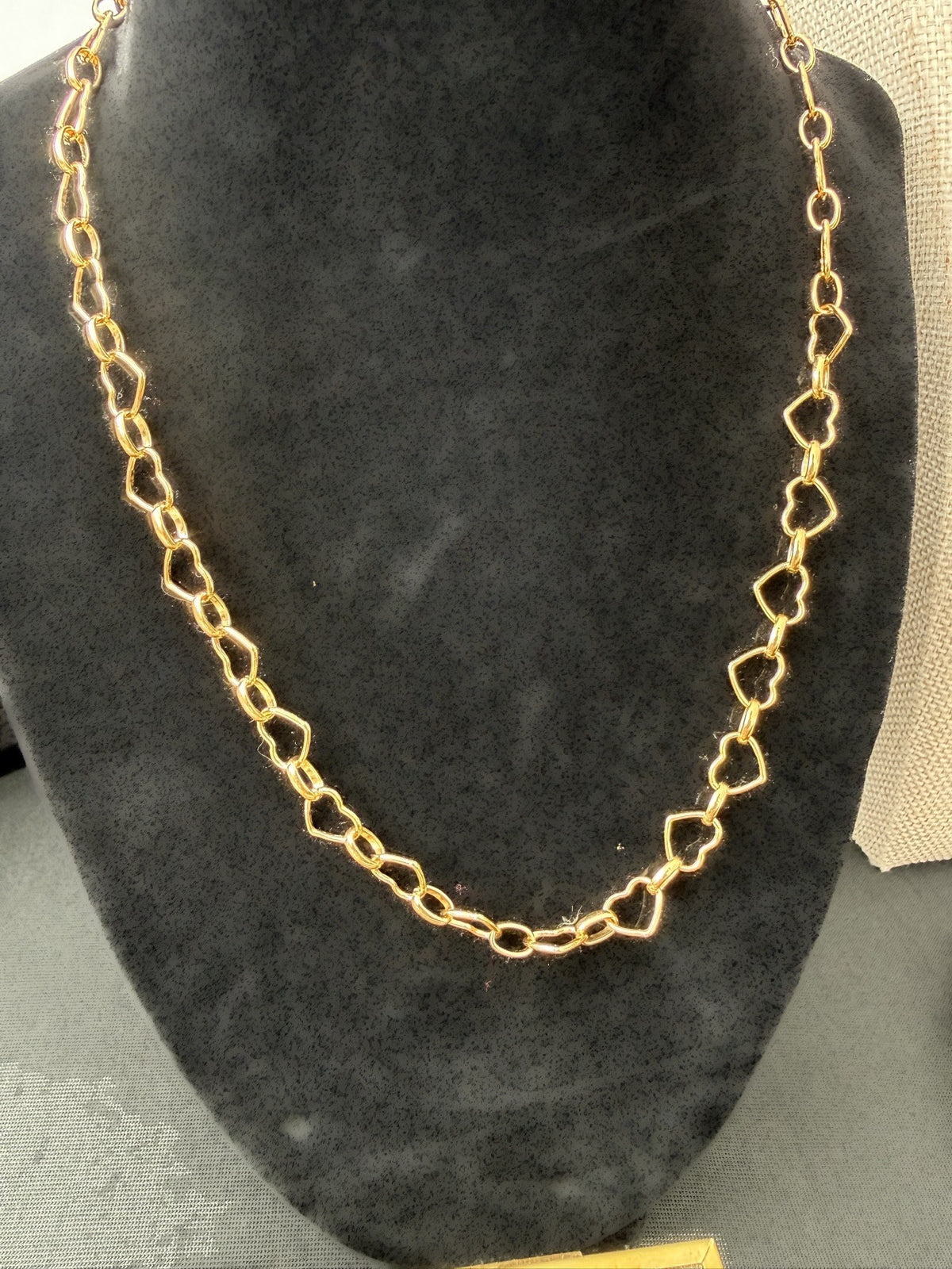 Gold-filled heart link necklace, 18 inches, on a black bust