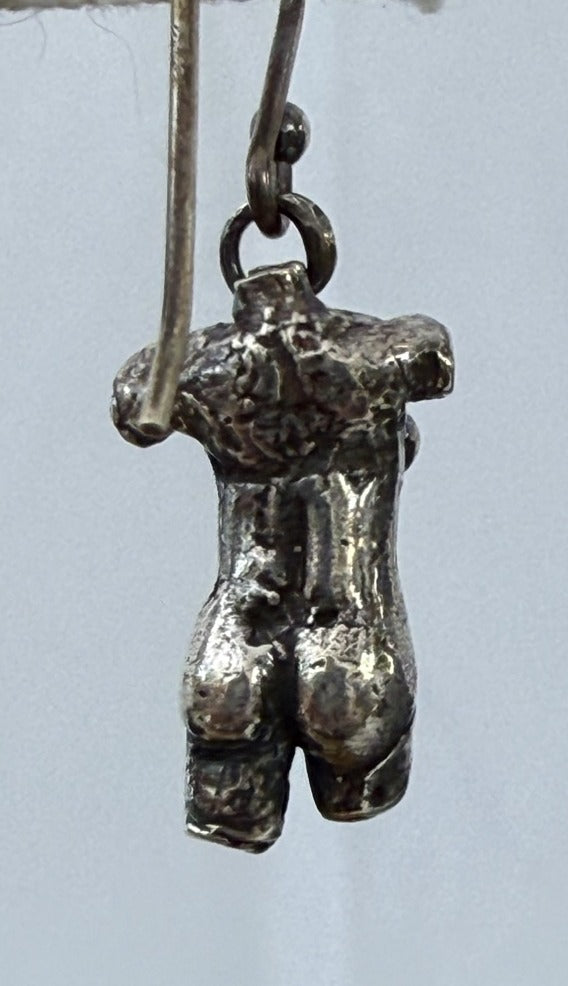 Male torso earring, back view